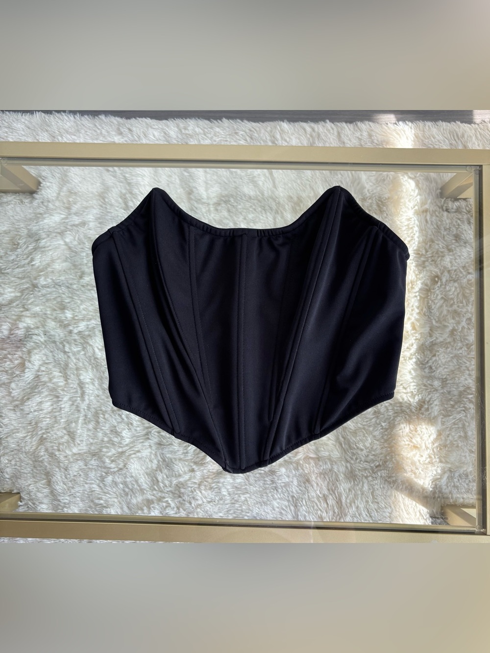 Black corset with gold zipper in back